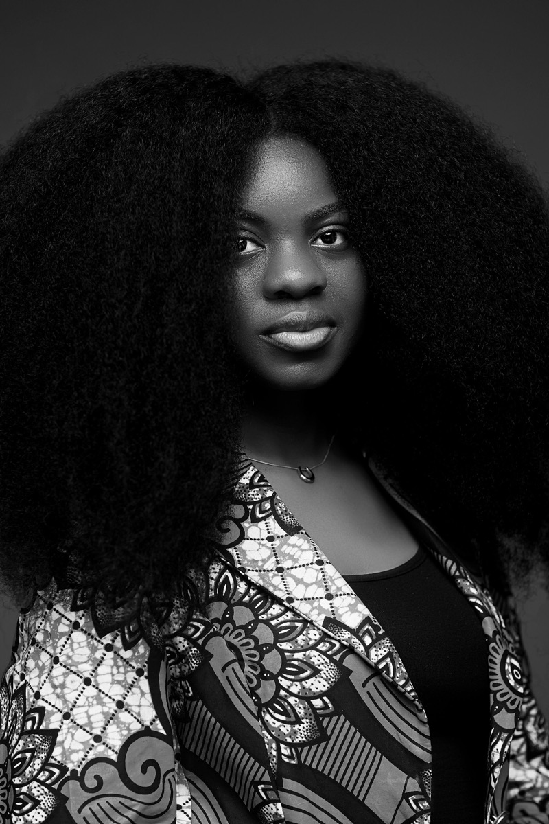 Type 4C coily hair styled in a voluminous afro